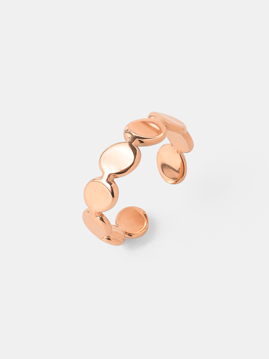 Roséfarbener offener Ring mit ovalen Elementen, glänzend, liegend auf hellem Untergrund.